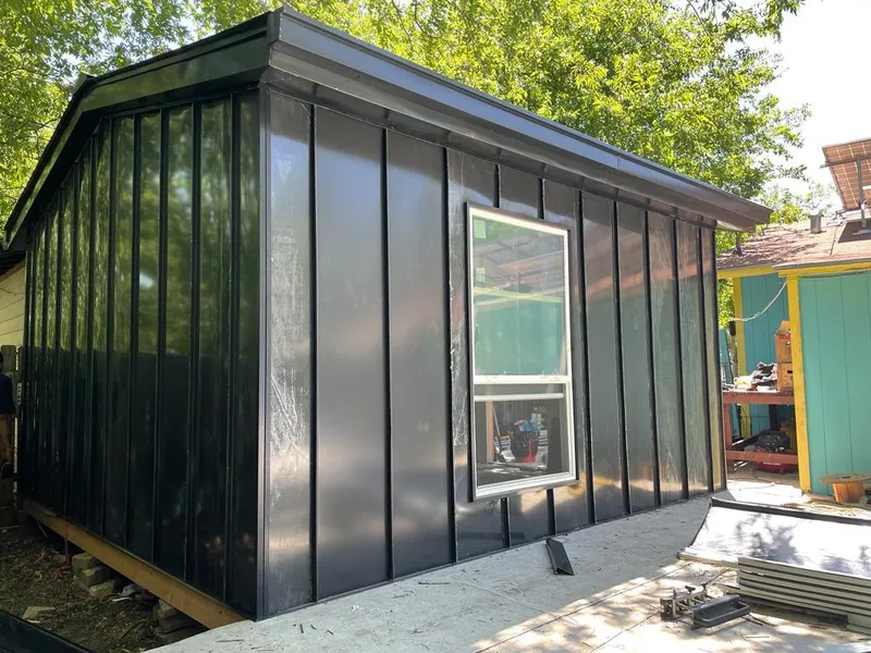 Black standing seam metal wall panels for Roof Inspection in Temescal Valley