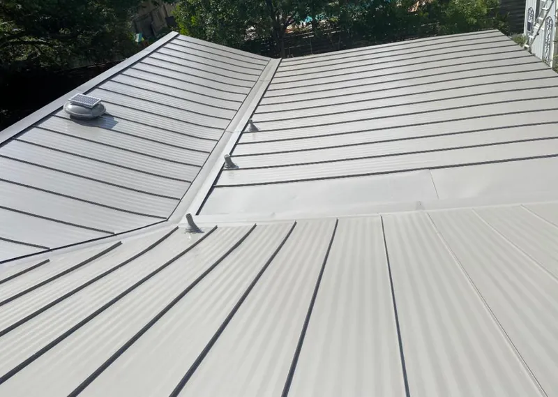 Solar attic fan installed on a metal roof for Roof Ventilation in Temescal Valley